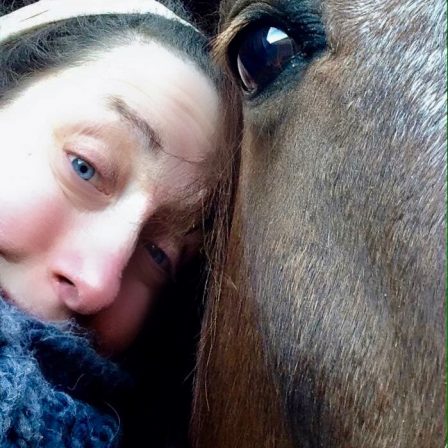 Jessica head to head with a horse