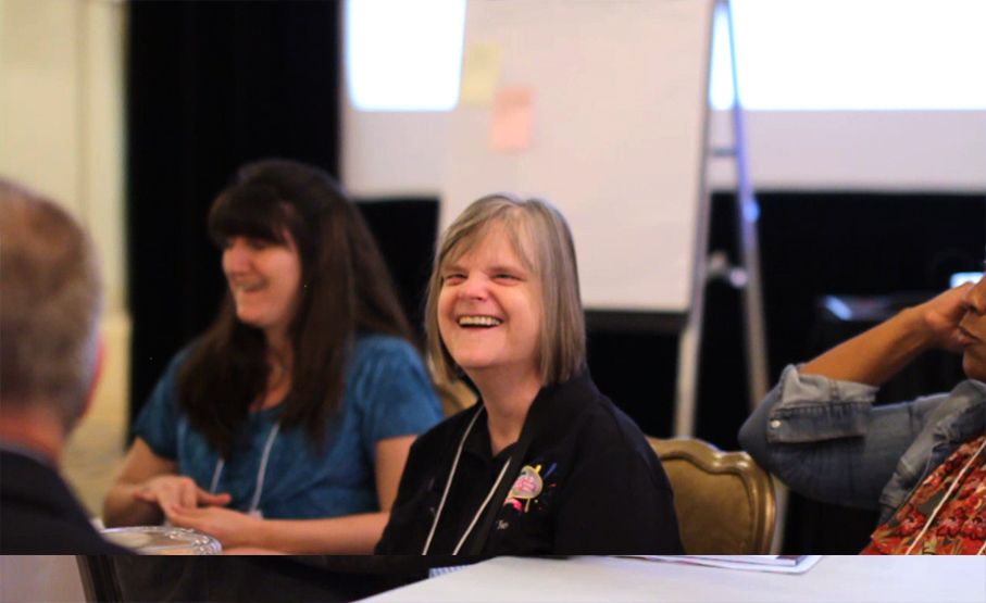 Suzanne joins in during a session at the Symposium - learning can be fun!