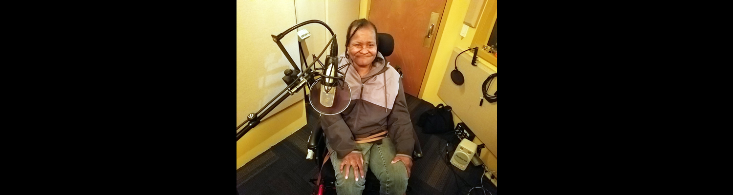 Debbie Scruggs smiling at the recording studio