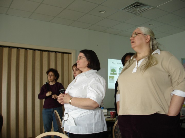 Diane, Doris, Beth, and Michelle at a Networks’ retreat. There is a slide with an assortment of trees in the background. Shauna is also in the background.