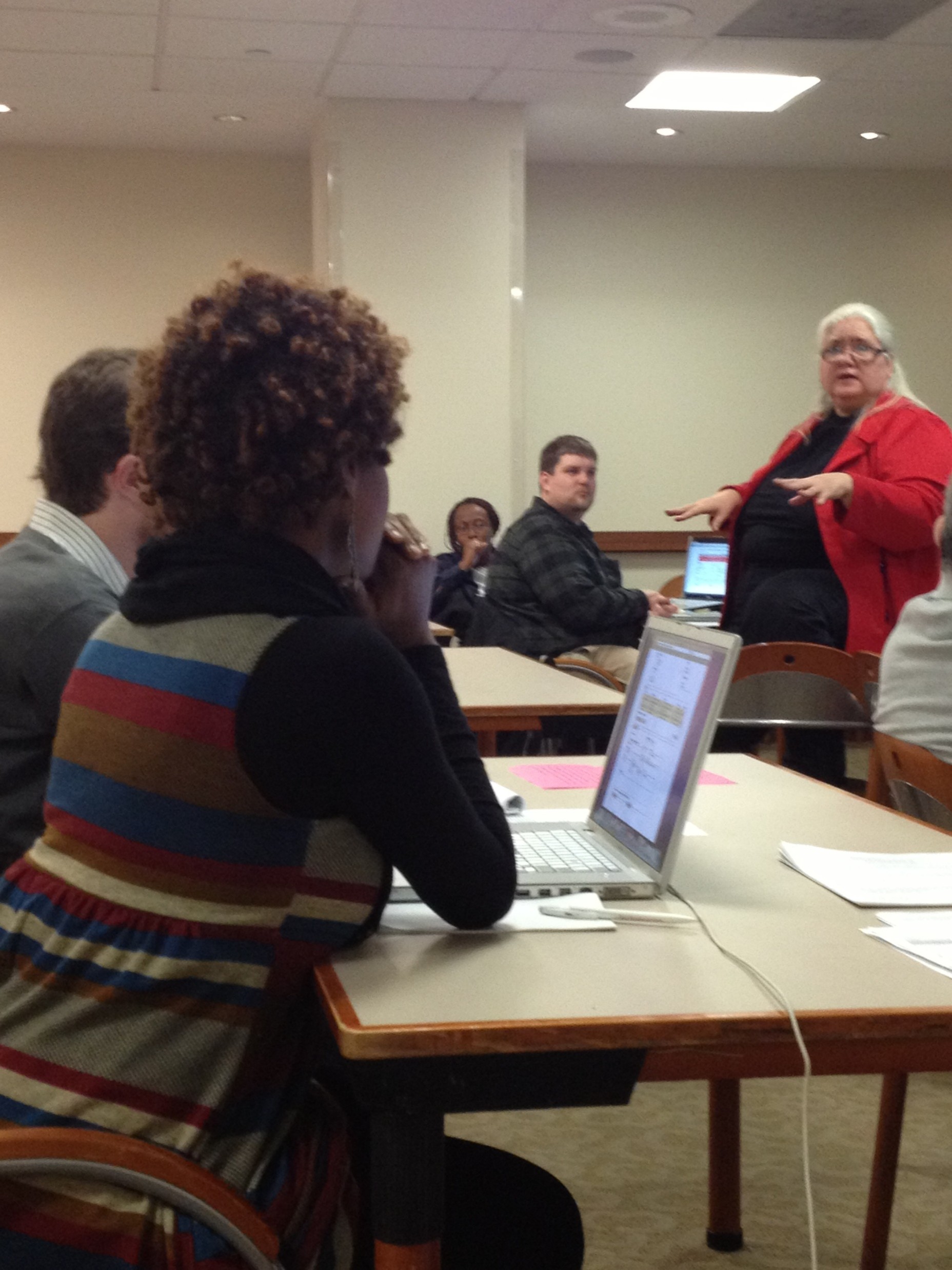 Diane teaching a technology class. Attendees are very attentive.
