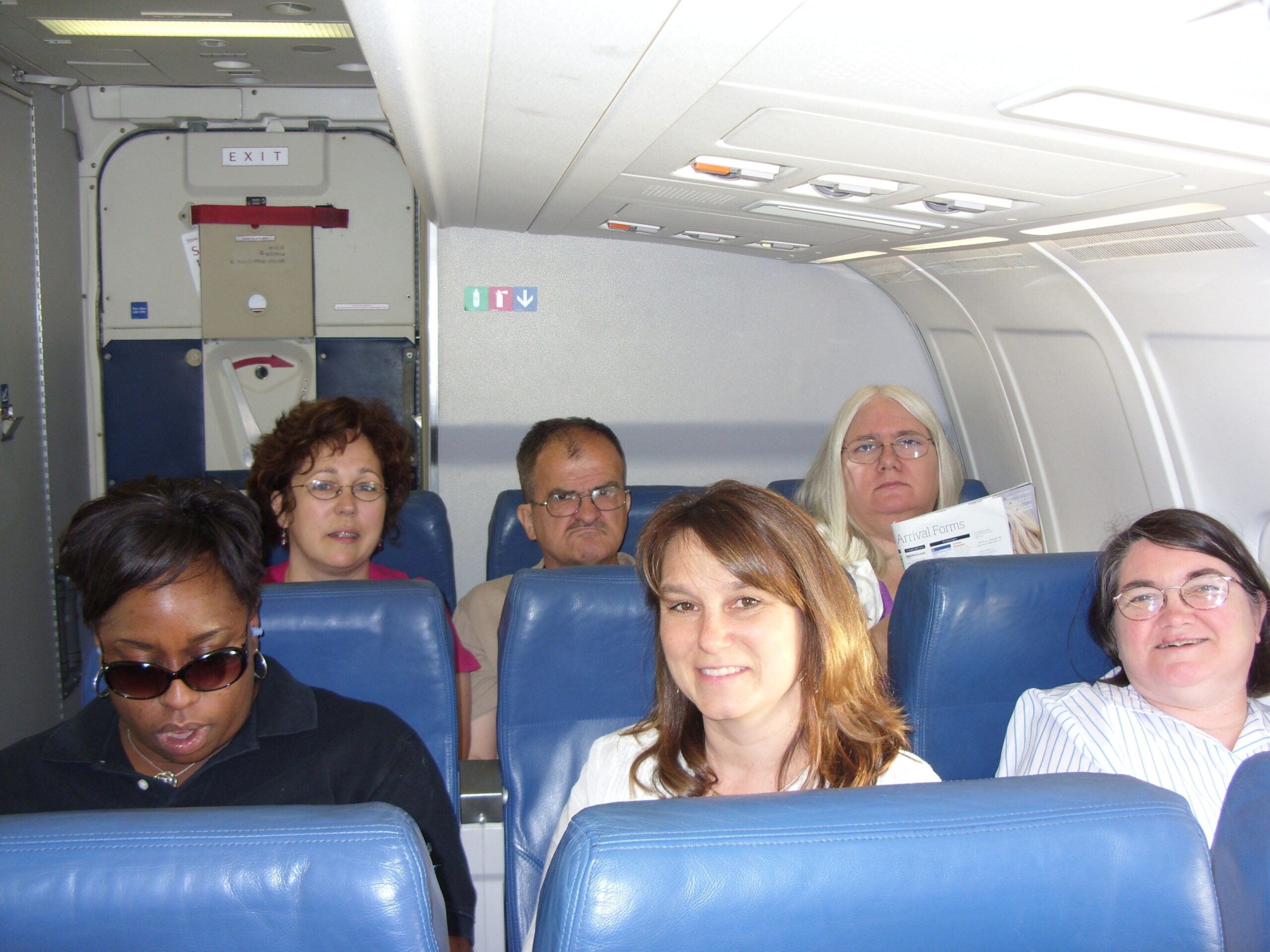 Beth, George, Diane, Shauna, Jill and Doris are seated on an airplane heading to a conference.