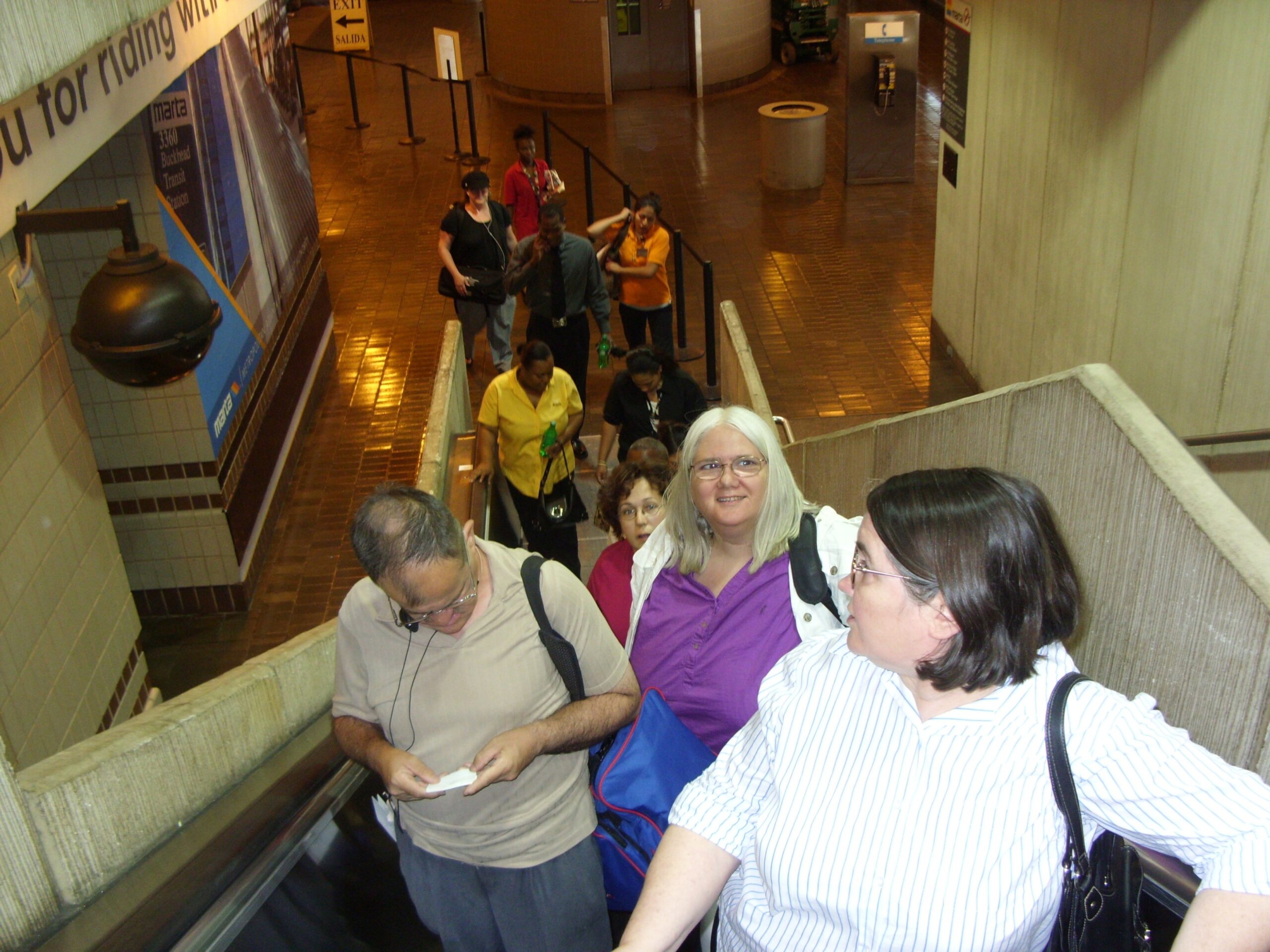 Someone took a photo of the Networks’ crew as they ascended up an escalator. Pictured are Diane, George, Doris, and Beth.
