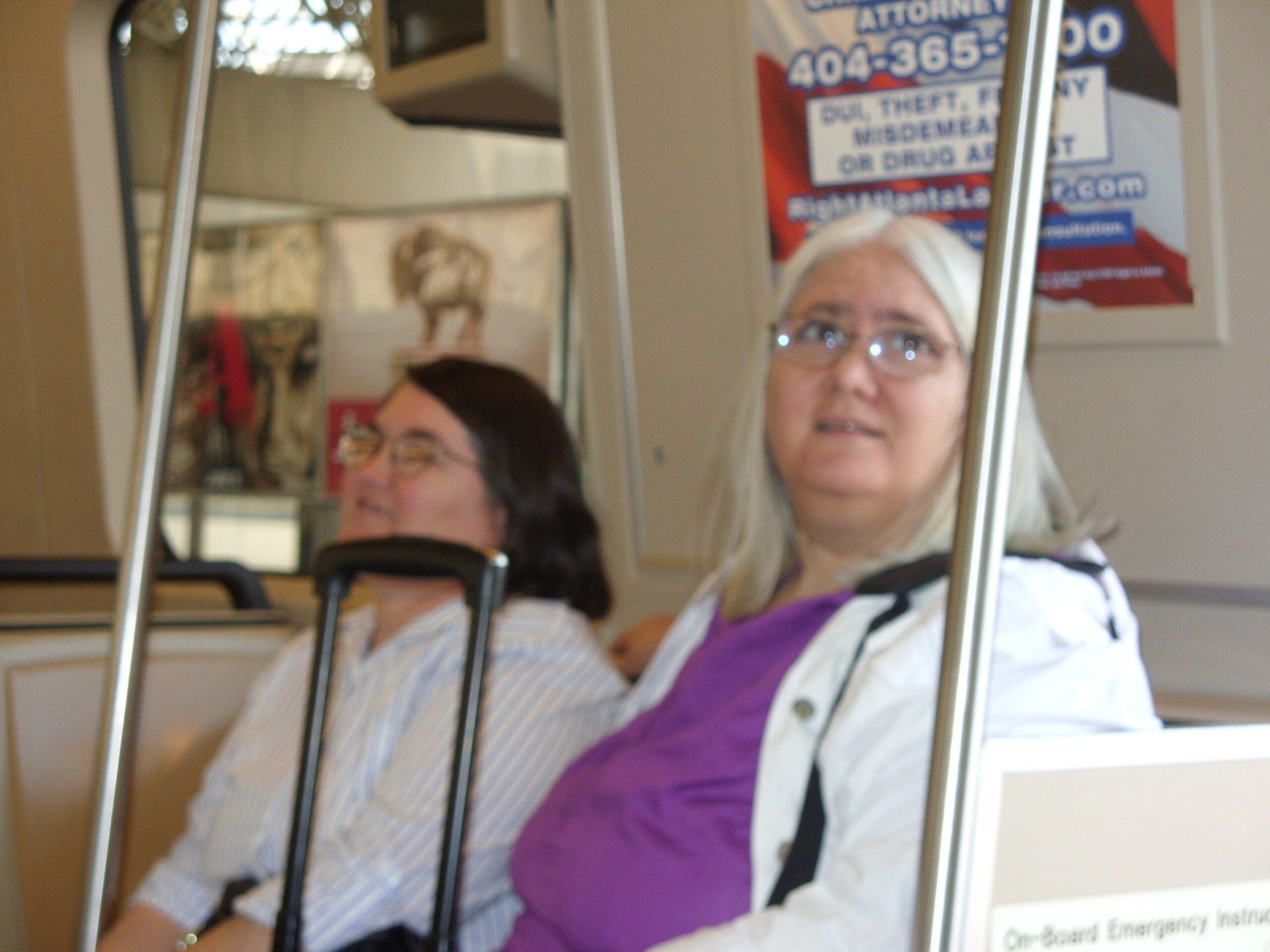 Diane and Doris are seated on a train going for a ride.
