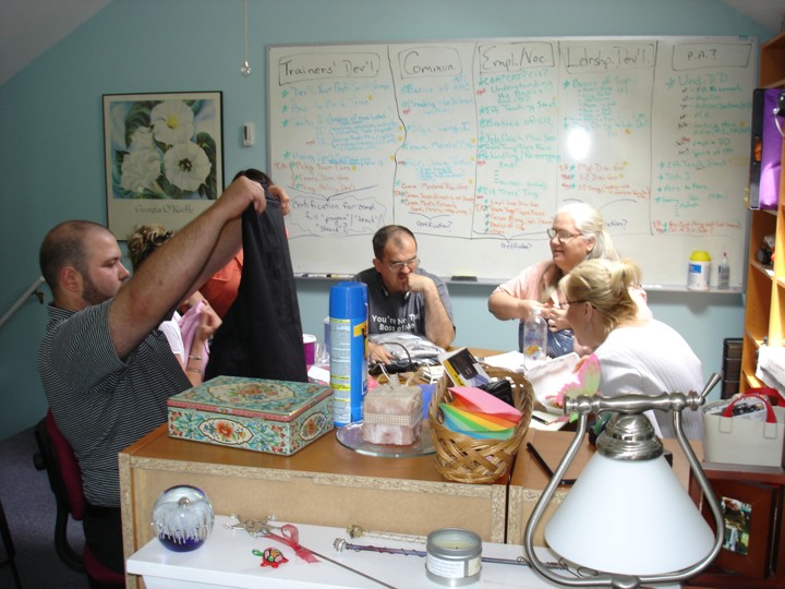Seated around the table at the Valley Forge office: Matt Bernardo, George, Diane, and Donna.