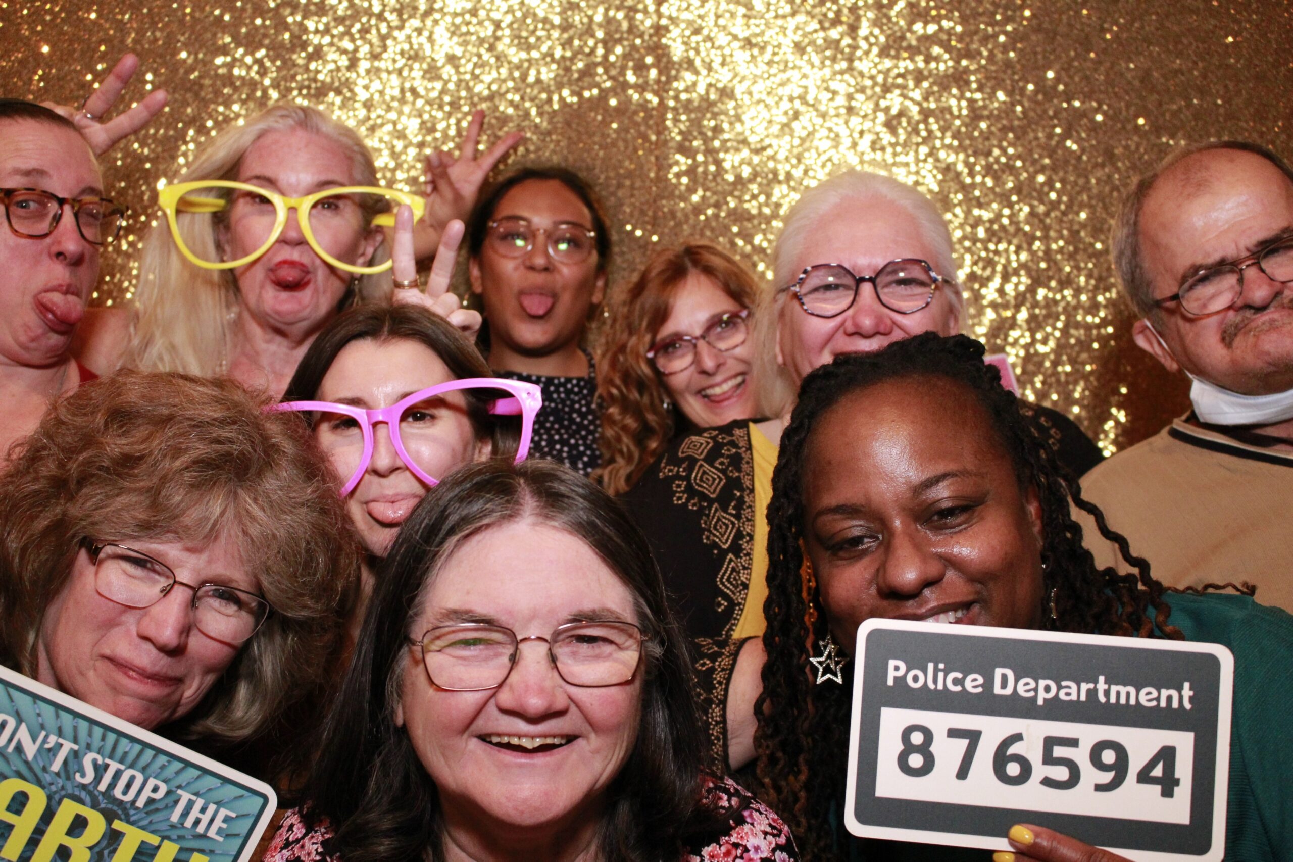 Another one! The Networks’ crew posing for a silly photo: Jess, Rosa, Nikita, Lexi, Tracy, Doris, Diane, Shauna, Michelle, George. Some wearing silly glasses and holding a police department sign.