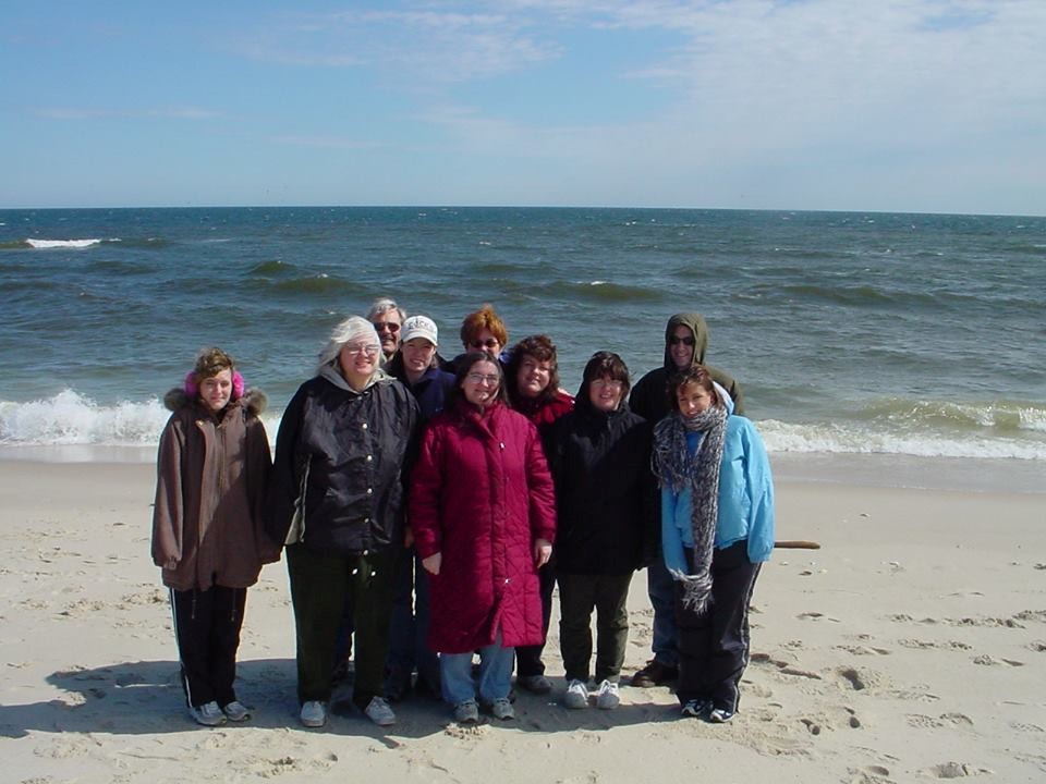 An old group shot of the Networks’ team at a retreat on the beach, where everyone was wearing winter coats! Circa 1996