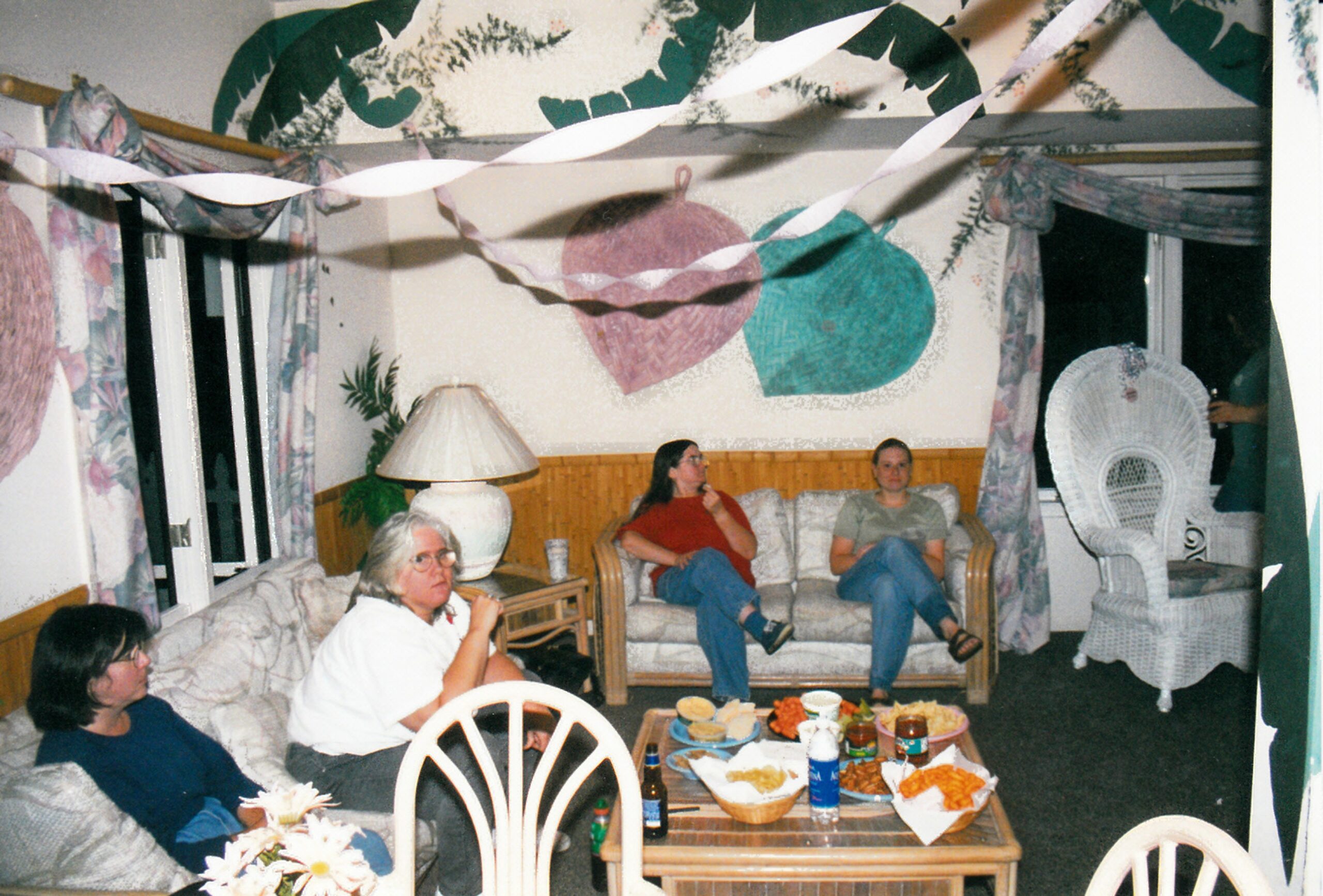 Diane, Doris and others at a Networks retreat laughing and looking to the side.