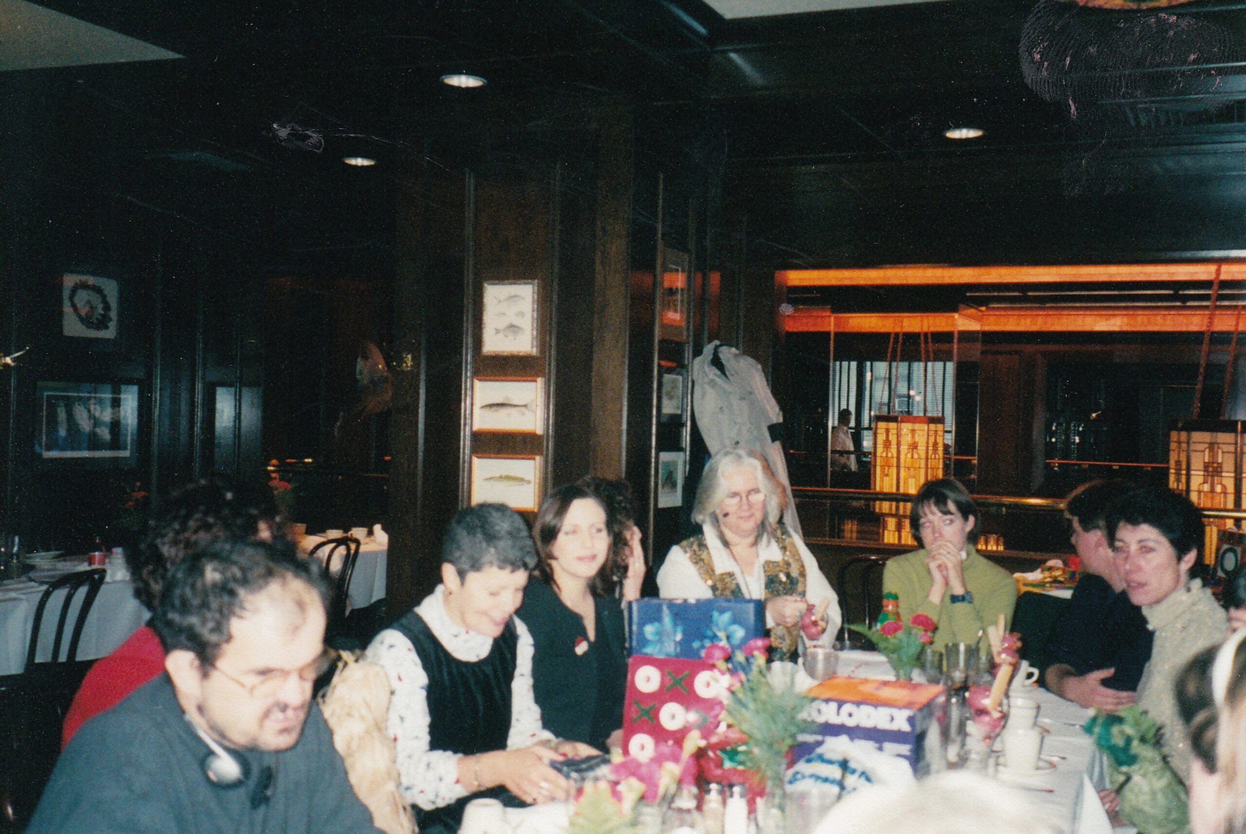 George, Marianne, Jen, Diane and others seated at a celebratory table.