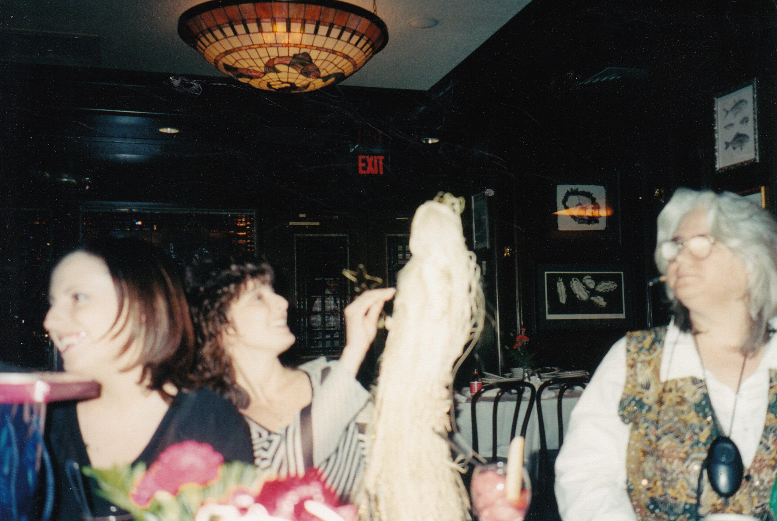 Michelle, Diane and others enjoying a nice meal together with some fun.
