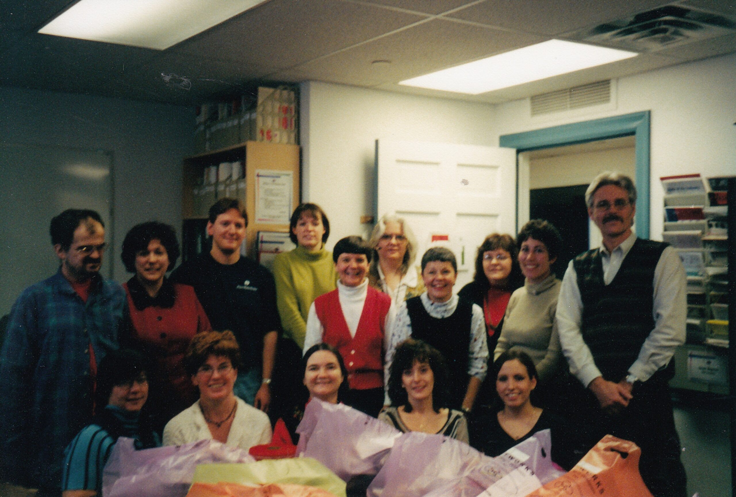 Mike, Diane, Leslie, George, Pat, Rosa Michelle, and several others pose in the Philadelphia office.