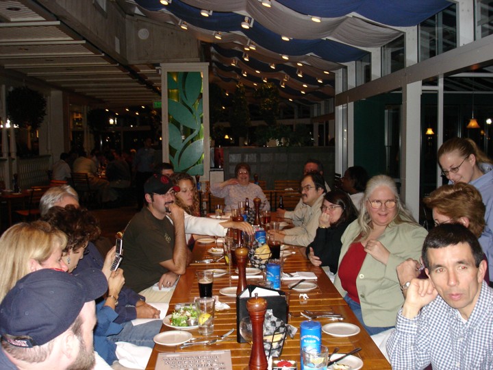 Seated around a large table enjoying a meal: Michael and Megan Landes, Donna, George, Diane, Doris, Rosa and several others!