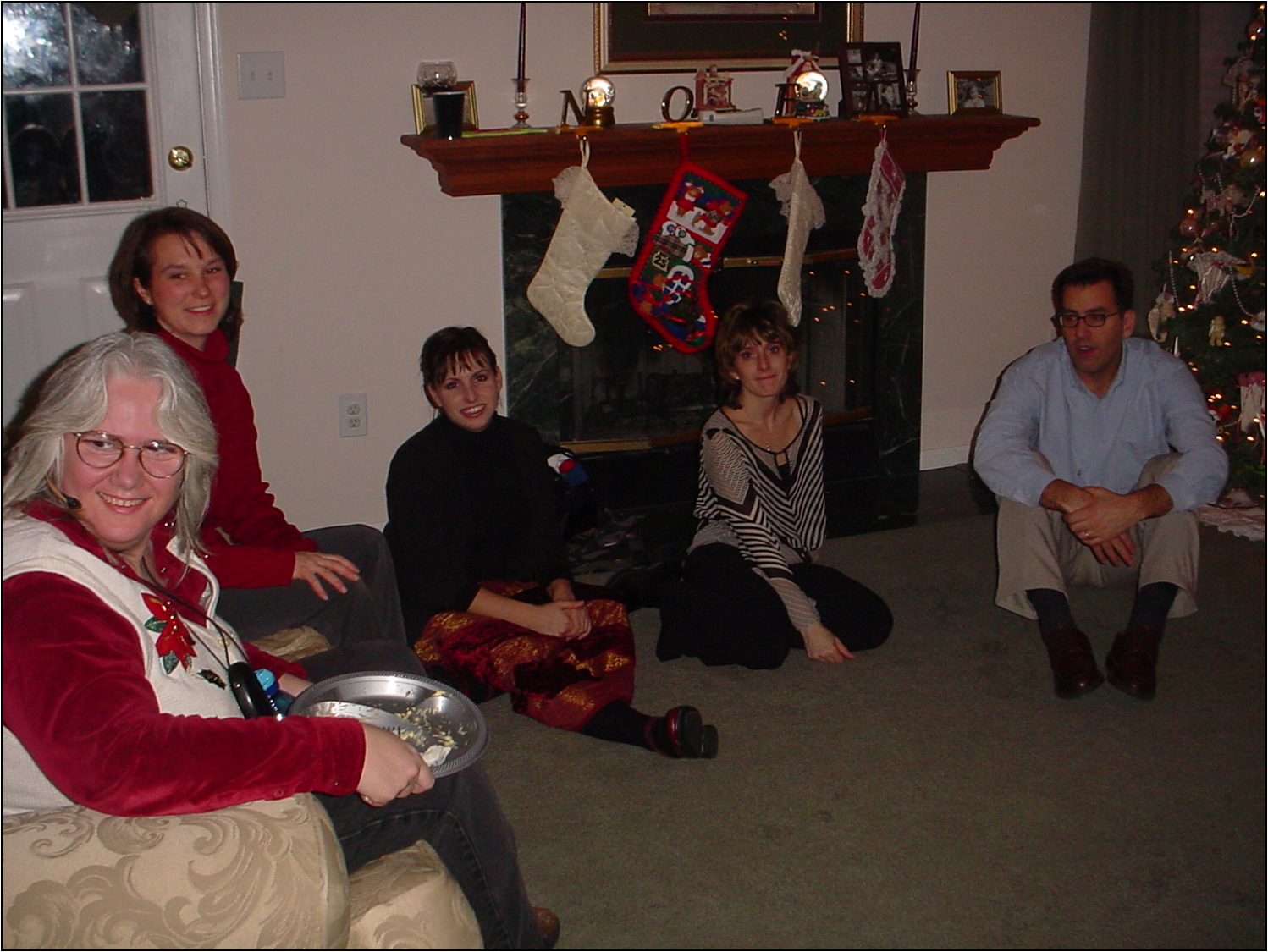 Diane, Jill, Michelle and others relaxing by the Christmas tree.