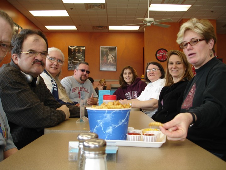 Rosa, George, Diane, Doris, Joe, Jill and Michelle sharing a big bucket of boardwalk fries.