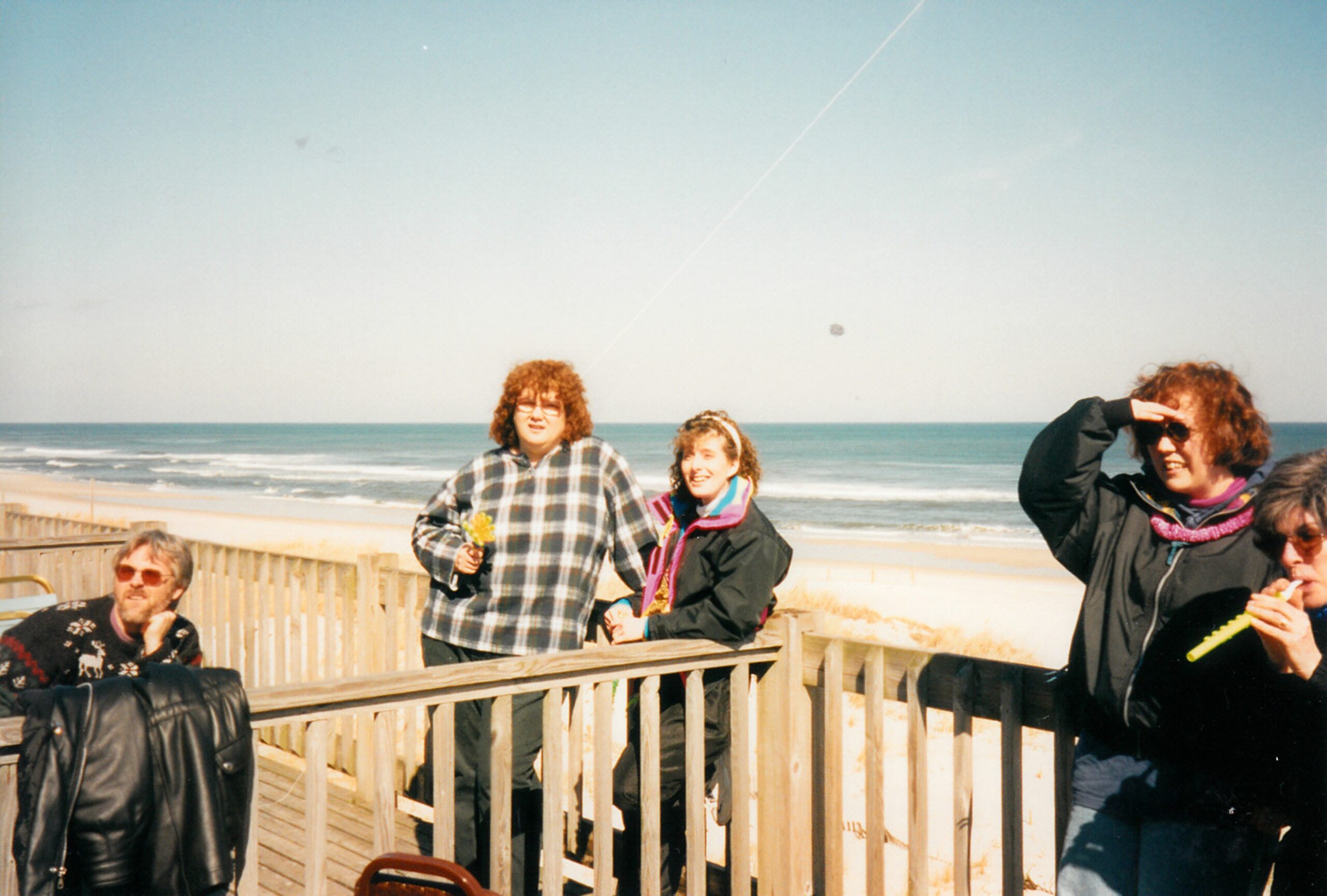 Diane, Michelle, Mike and others outside on the beach.